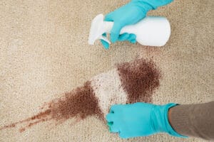 A carpet with red wine stain that need deep cleaning services in Plano, TX