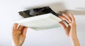 Bathroom exhaust fan that is undergoing cleaning service in Plano, TX