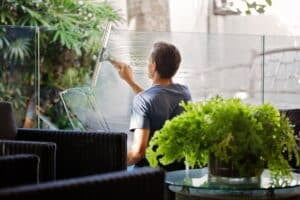 man Cleaning Windows for house cleaning Plano TX