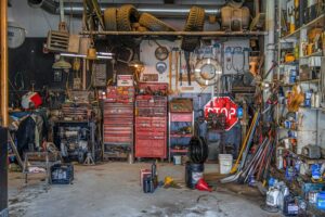 messy garage with tools and toolboxes that need deep cleaning services from Dallas Sunrise Maids Plano, TX