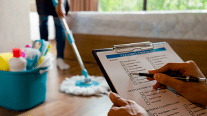 Cleaning checklist with a person mopping in the background Dallas Sunrise Maids in Plano, TX