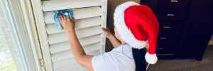 Dallas Sunrise Maids team member wearing a santa hat in the process of house cleaning in Plano, TX