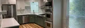 Bright modern kitchen with stainless steel ovens and white cabinets cleaned to perfection by Dallas Sunrise Maids, showcasing move out cleaning vs deep cleaning in Plano, TX
