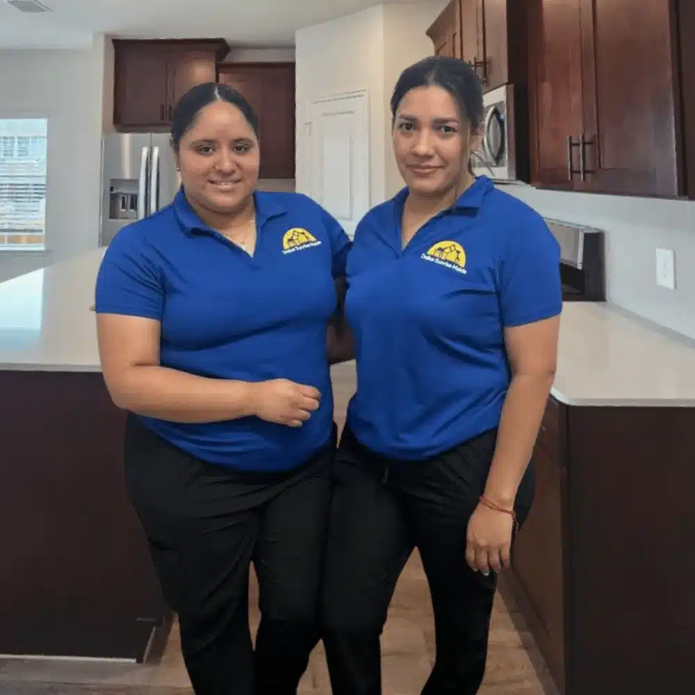 Team photo of Dallas Sunrise Maids subcontractors standing together with cleaning supplies in Plano, TX