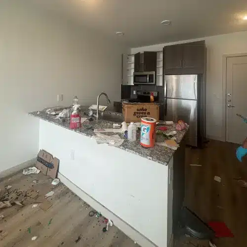 Messy kitchen with cluttered granite countertop before deep cleaning service by Dallas Sunrise Maids | House Cleaning Plano, TX