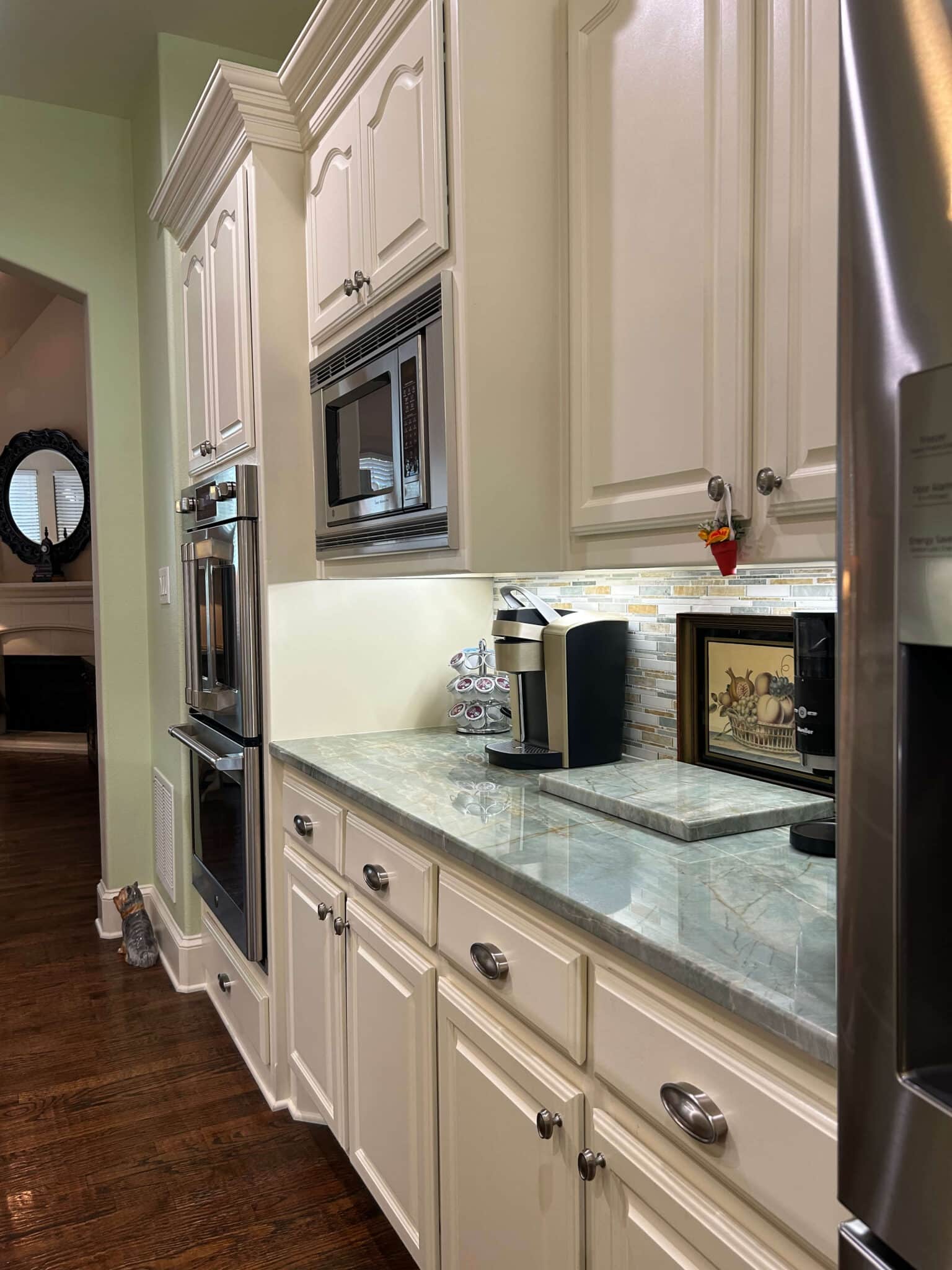 Clean and organized kitchen countertops with spotless cabinetry reflecting professional house cleaning standards in Plano, TX by Dallas Sunrise Maids