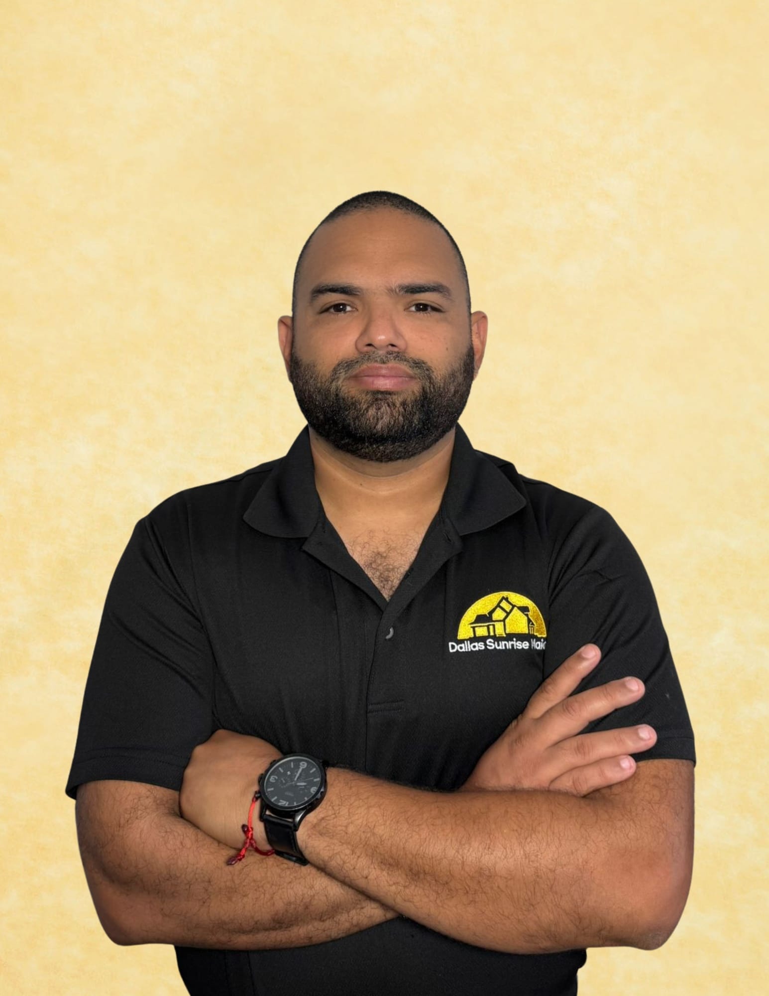 Headshot portrait of Jason Flores sunrise maids owner wearing a black collared shirt with crossed arms, representing professional home cleaning in Plano, Texas by Dallas Sunrise Maids.