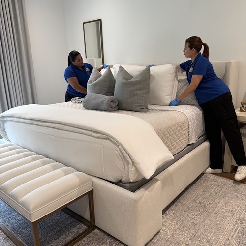 Cleaning team arriving at a high-rise with supplies for condo cleaning in Dallas by Dallas Sunrise Maids