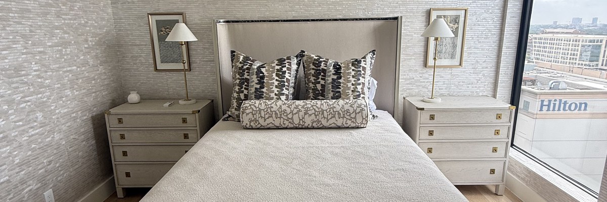 Bright high-rise condo living space with Dallas skyline view after condo cleaning in Dallas by Dallas Sunrise Maids